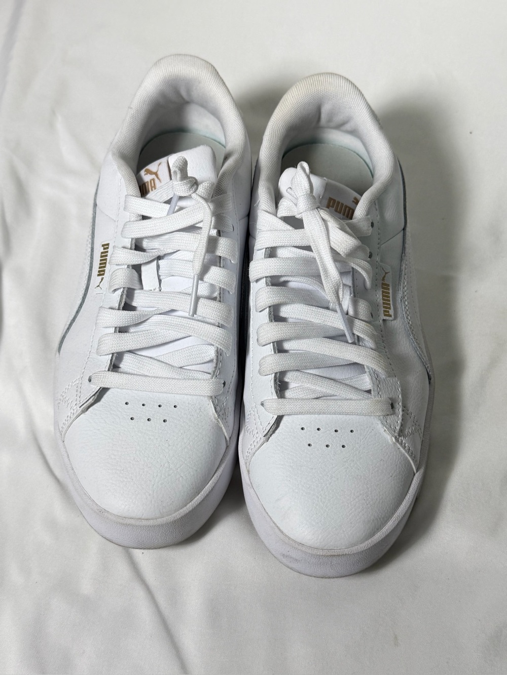 Puma Women’s White Sneakers with Gold Logo Accents
